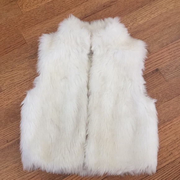 white fuzzy vest